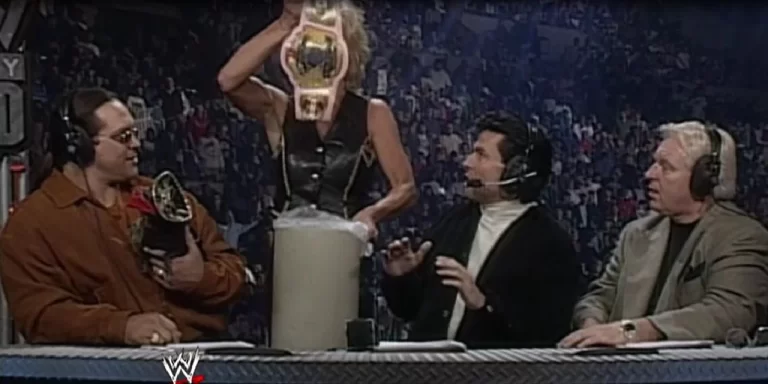 Madusa jogando o cinturão da WWE no lixo, um exemplo de Forbidden Door