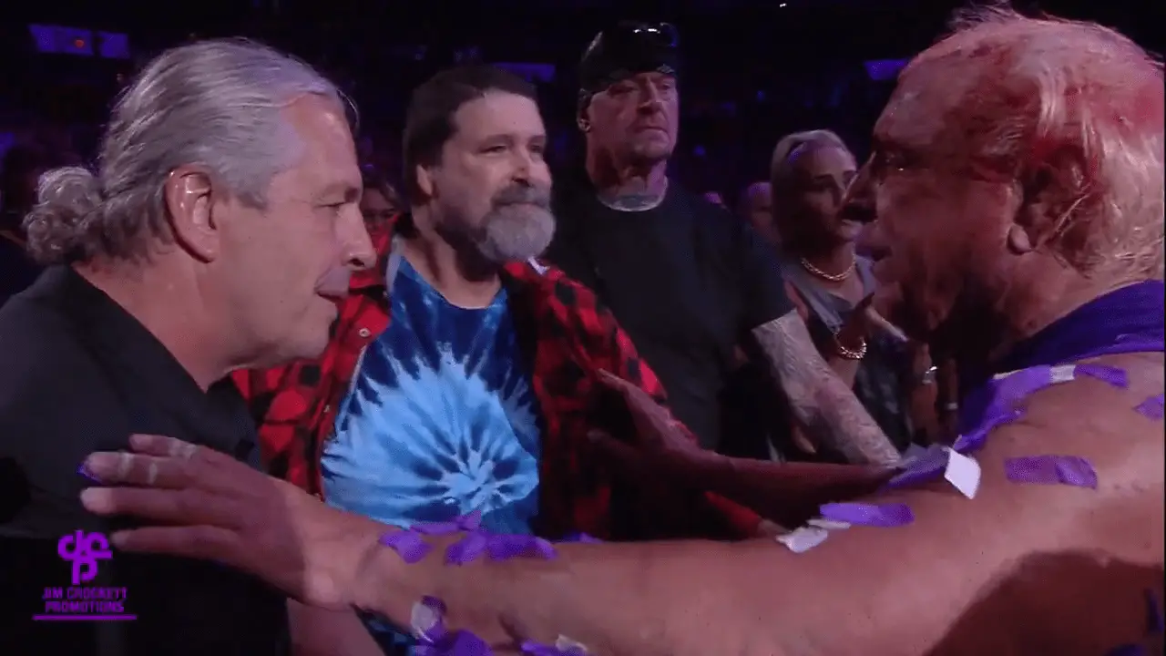 Undertaker, Bret Hart e Mick Foley com Ric Flair